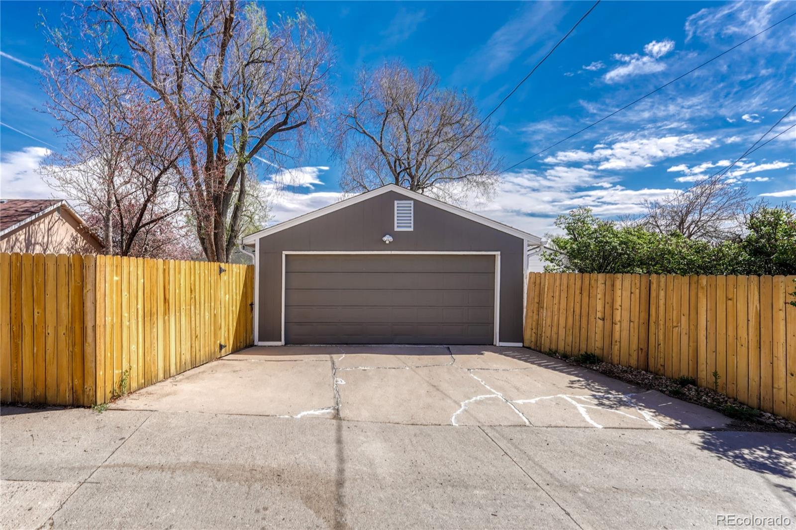 1111 South Perry Street Denver, CO 80219 - Photo 23 of 23 a front view of a house with yard