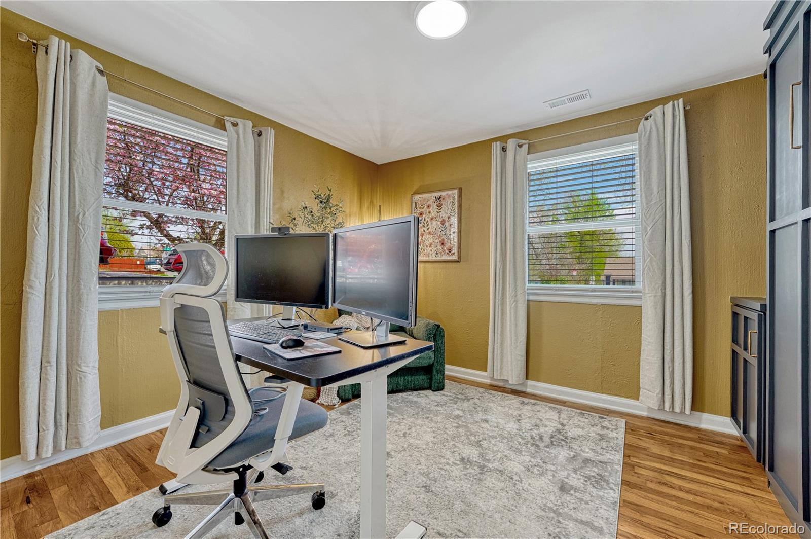1111 South Perry Street Denver, CO 80219 - Photo 7 of 23 a workspace with furniture and window