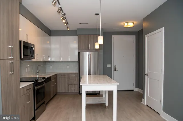 a kitchen with a table and chairs in it