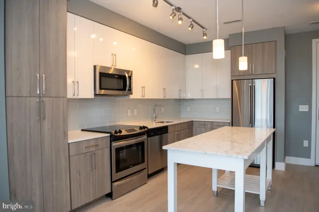 a kitchen with a stove and a microwave