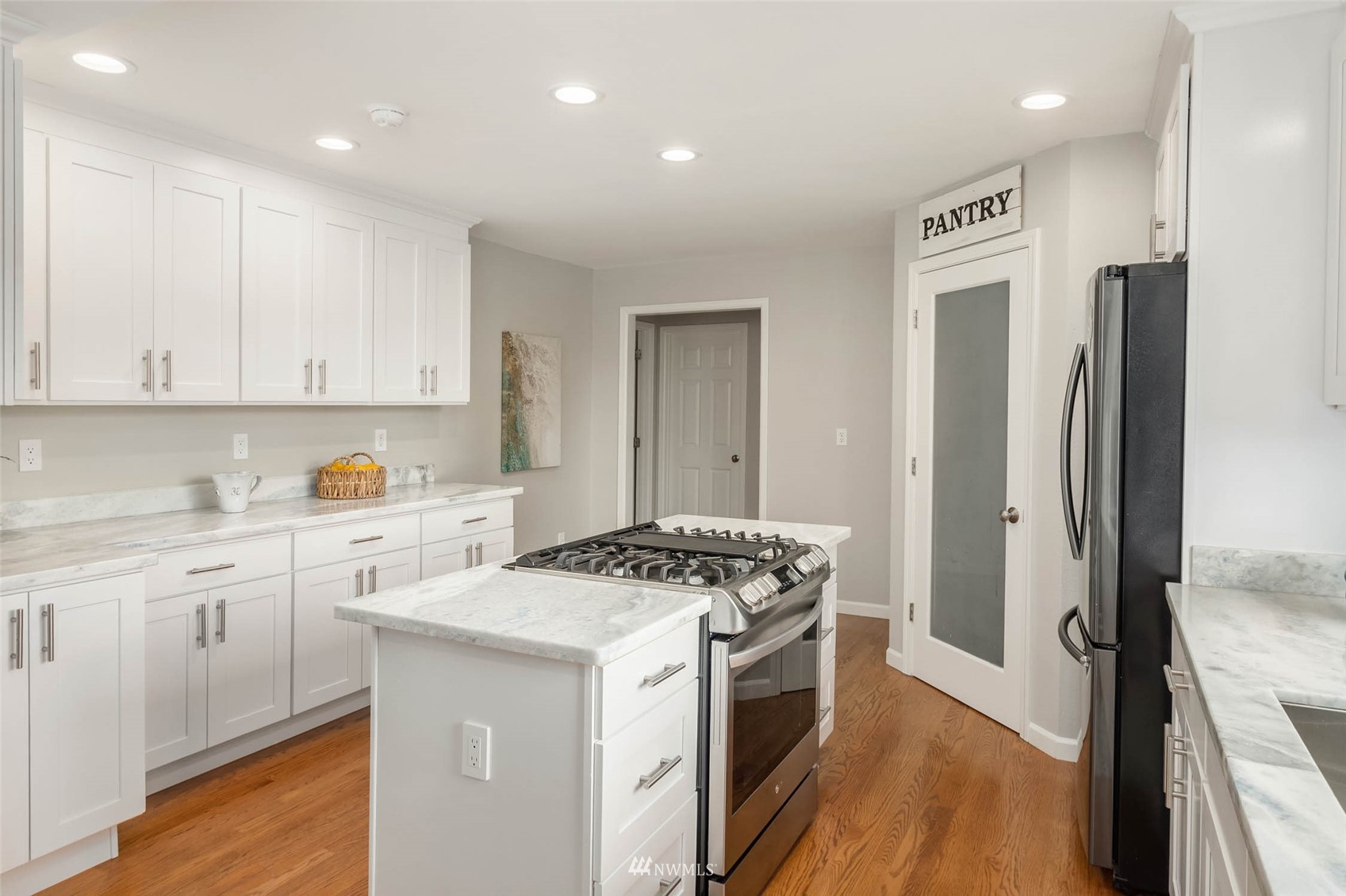 314 171st Street Southeast Bothell, WA 98012 - Photo 11 of 36 a kitchen with stainless steel appliances a stove a sink and a refrigerator