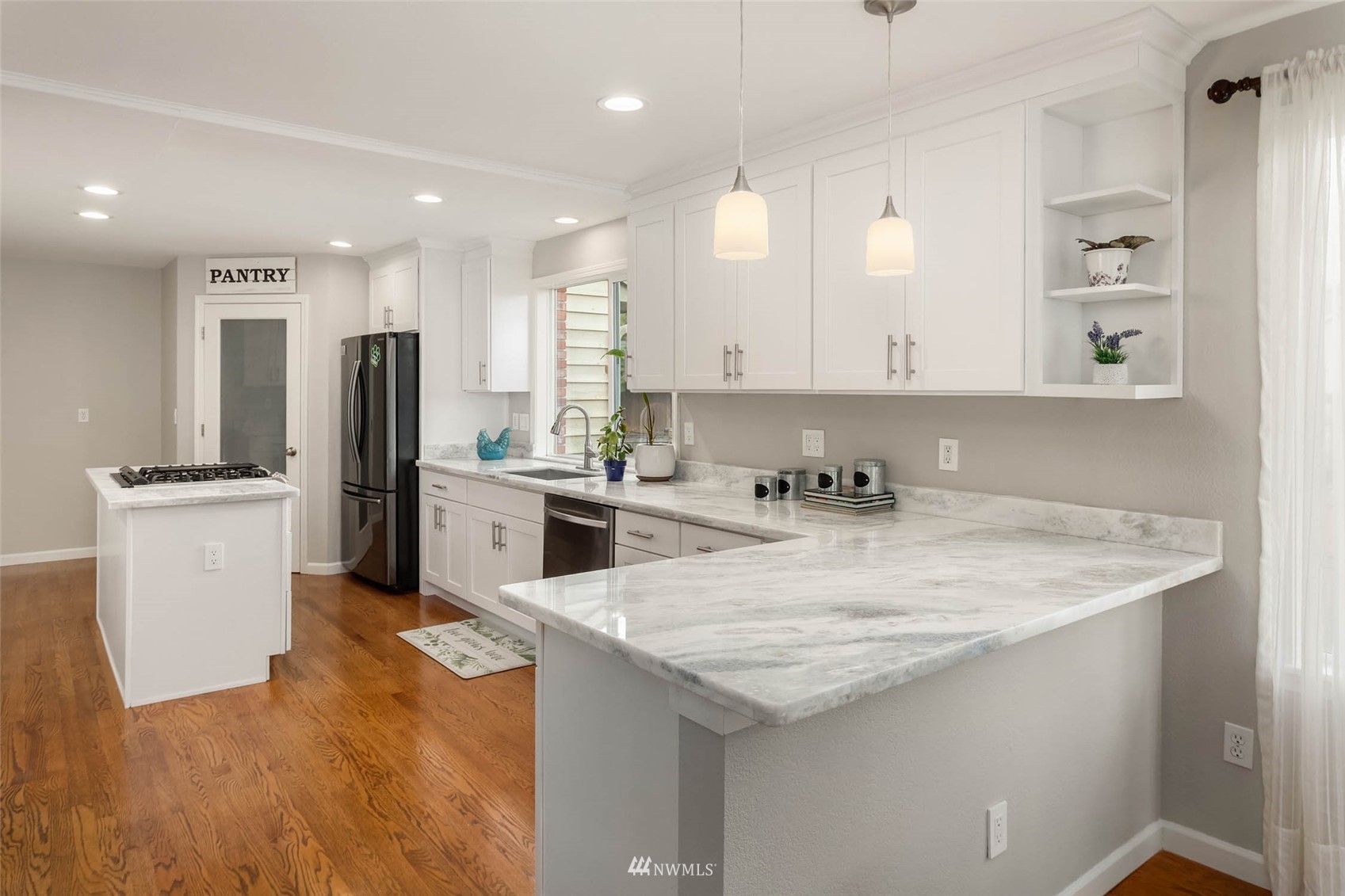 314 171st Street Southeast Bothell, WA 98012 - Photo 8 of 36 a kitchen with stainless steel appliances granite countertop a sink a stove and a refrigerator