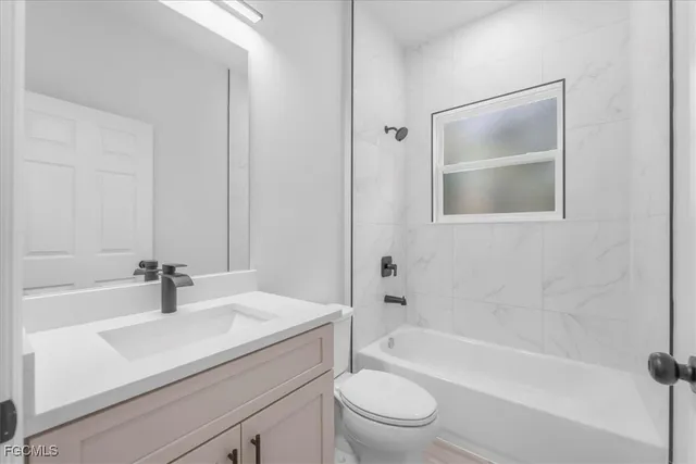 a bathroom with a sink a bathtub and a toilet