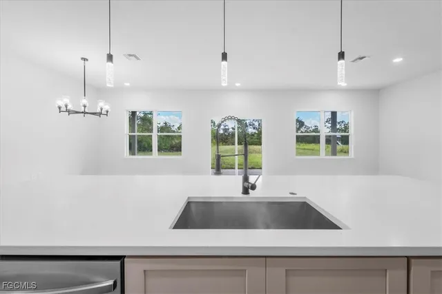 a view kitchen with a sink and window