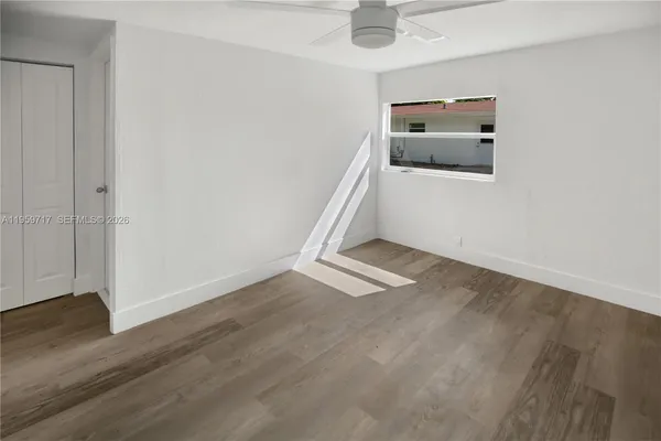 a view of a livingroom with wooden floor