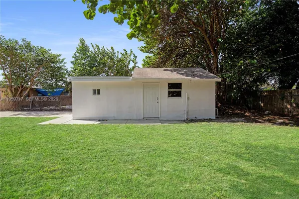 a house with a tree in front of it