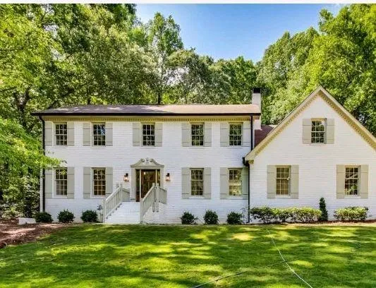 a view of house with yard