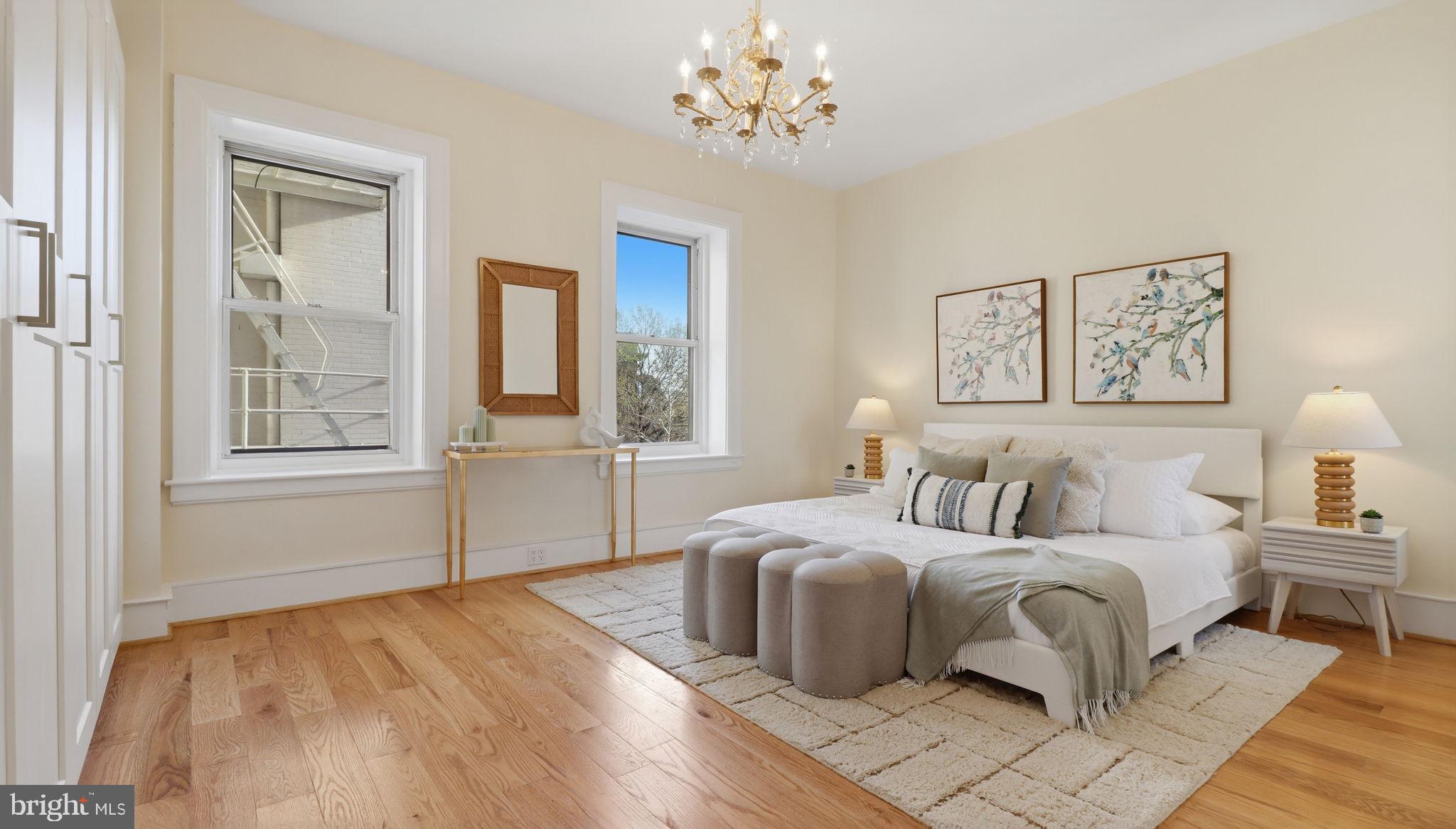 2205 California Street Northwest, Unit 303 Washington, DC 20008 - Photo 21 of 52 a bedroom with a large bed and a window