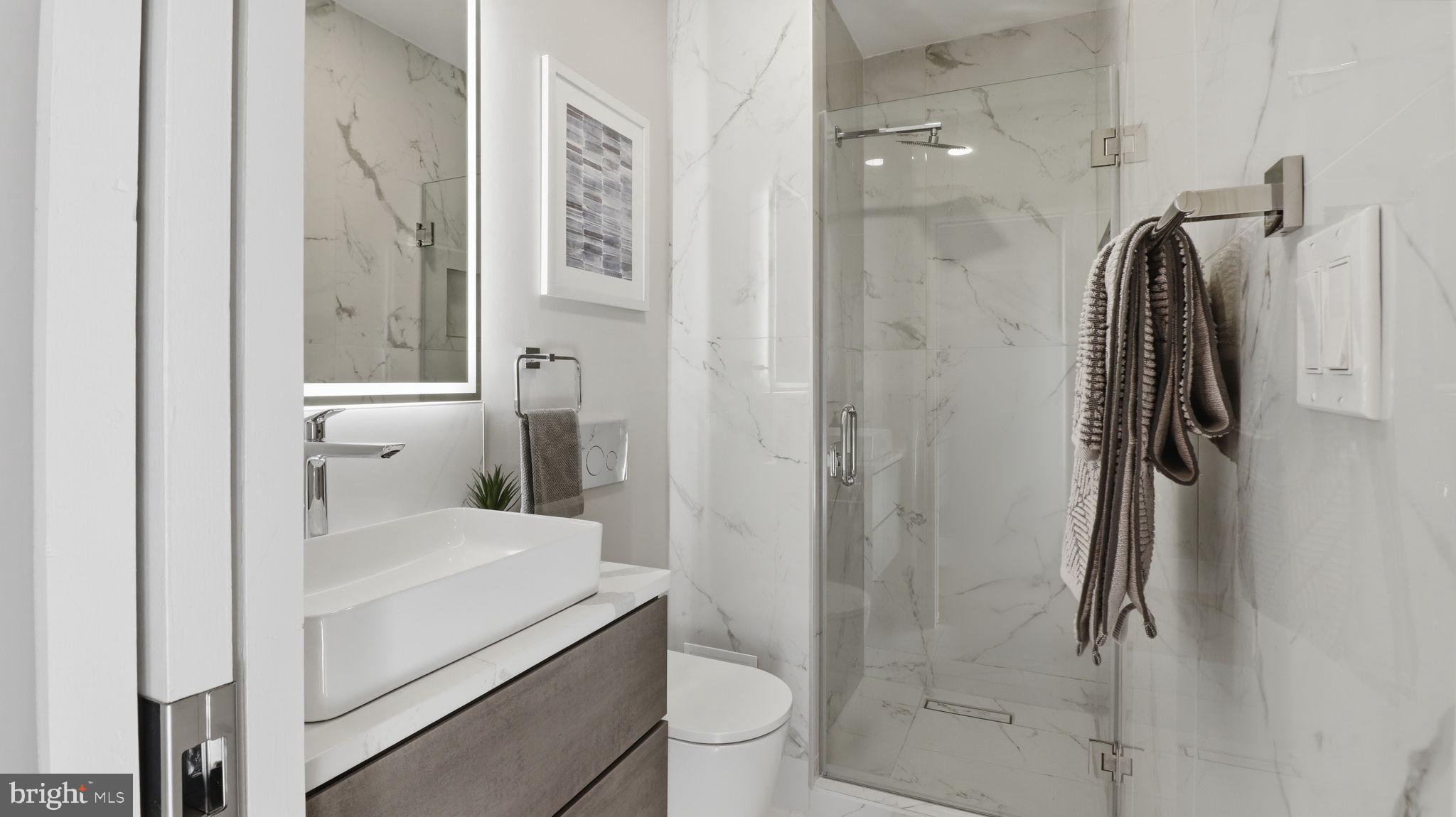 2205 California Street Northwest, Unit 303 Washington, DC 20008 - Photo 26 of 52 a bathroom with a sink toilet and shower