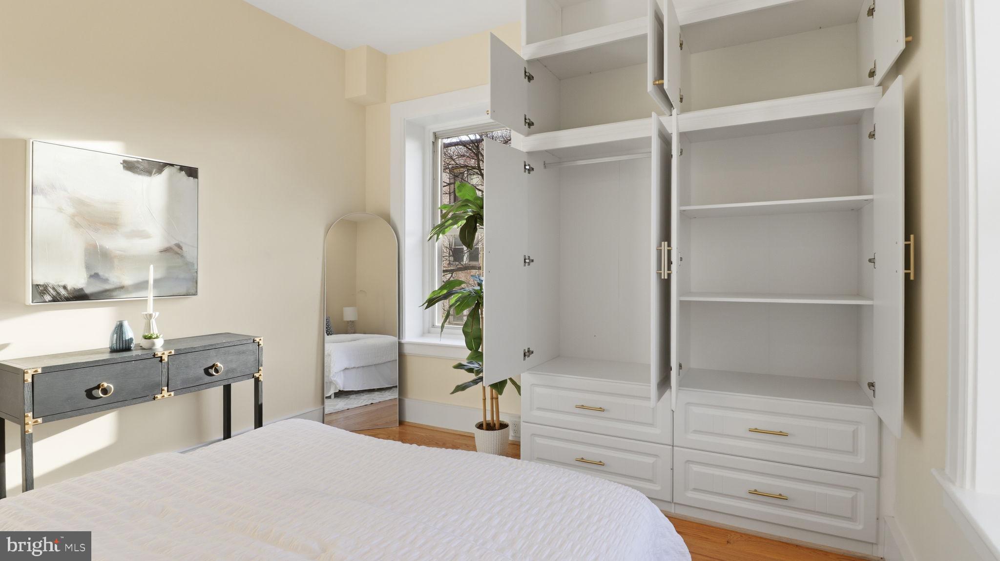 2205 California Street Northwest, Unit 303 Washington, DC 20008 - Photo 30 of 52 a room with a bed and a dresser