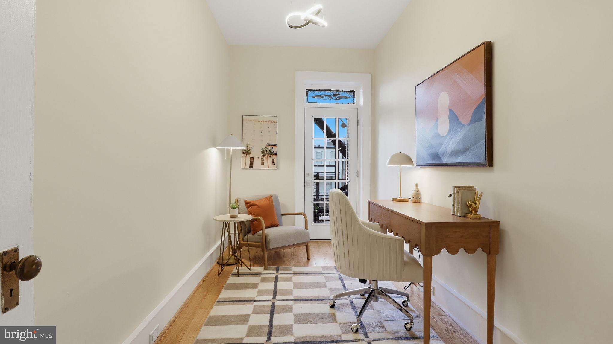 2205 California Street Northwest, Unit 303 Washington, DC 20008 - Photo 33 of 52 a living room with furniture and a table