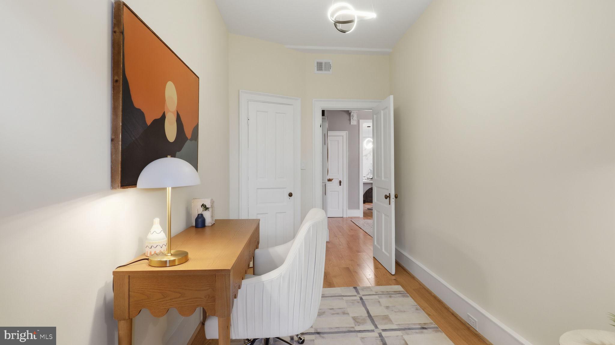 2205 California Street Northwest, Unit 303 Washington, DC 20008 - Photo 39 of 52 a living room with furniture and a window