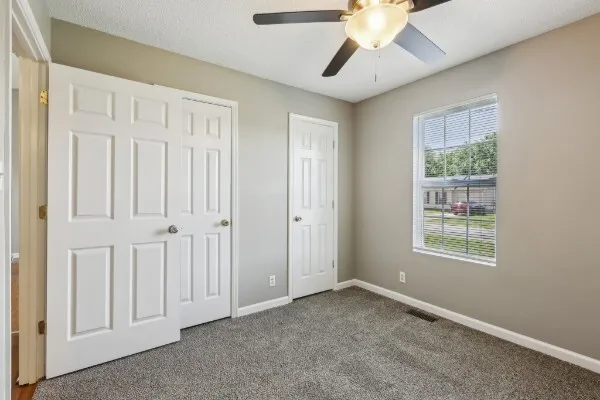 a view of an empty room with a window