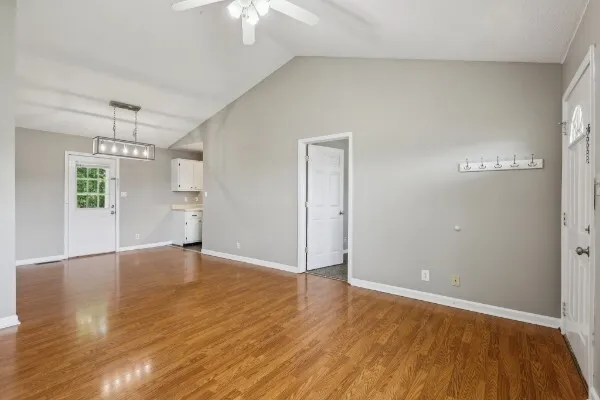 wooden floor in an empty room with a window