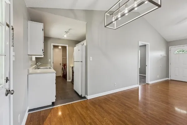 a view of a storage & utility room with two washing machine
