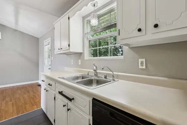 a kitchen with a sink and cabinets