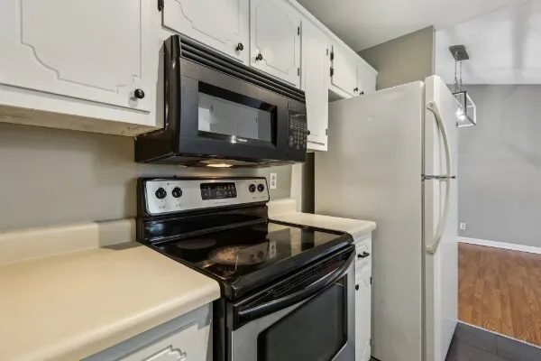 a kitchen with a stove and a microwave