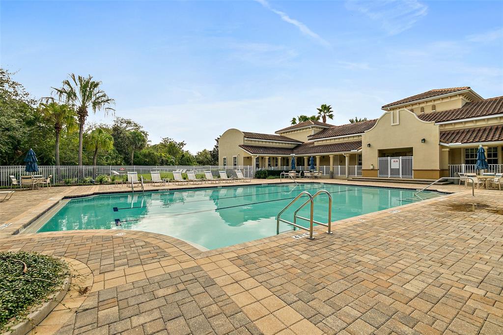 49 Longview Way North Palm Coast, FL 32137 - Photo 30 of 43 a view of a swimming pool with a lounge chairs