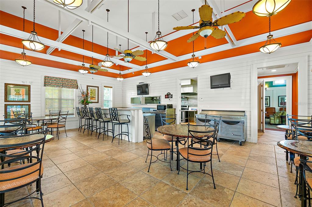 49 Longview Way North Palm Coast, FL 32137 - Photo 32 of 43 a outdoor space with lots of chairs and a table