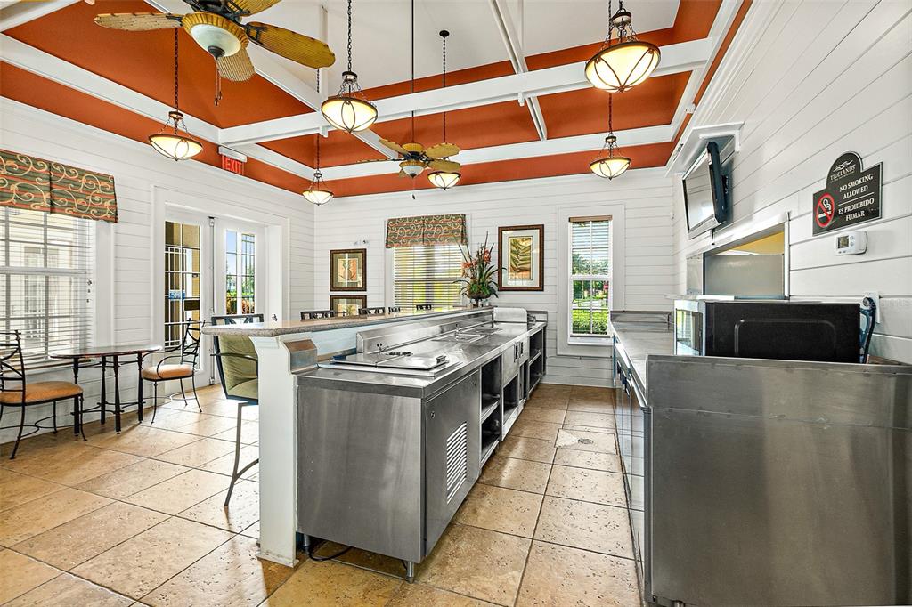 49 Longview Way North Palm Coast, FL 32137 - Photo 34 of 43 a kitchen with stainless steel appliances granite countertop a stove and cabinets