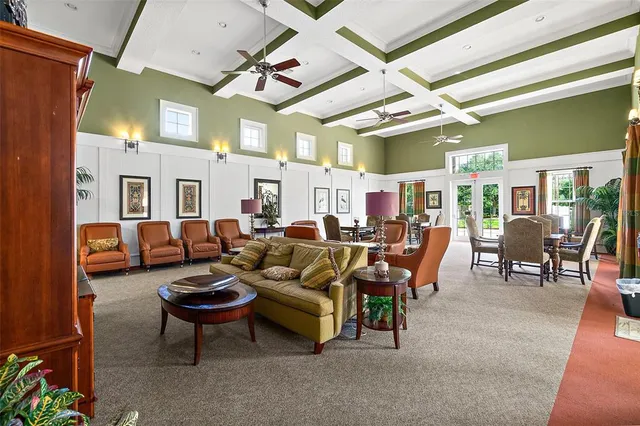 a room with pool table and windows