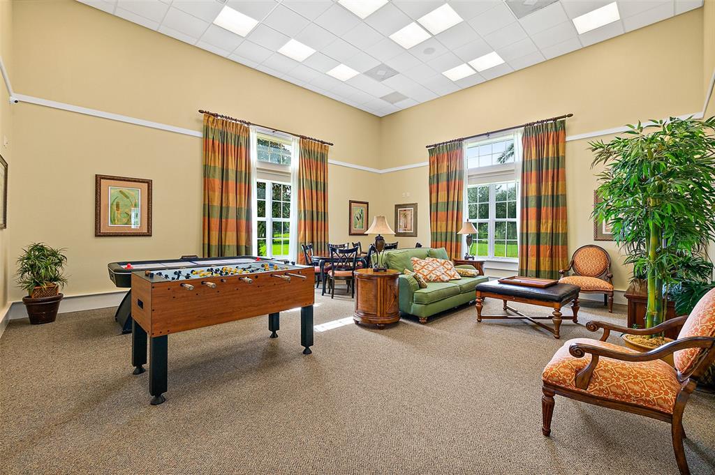 49 Longview Way North Palm Coast, FL 32137 - Photo 37 of 43 a outdoor living space with furniture and a potted plant