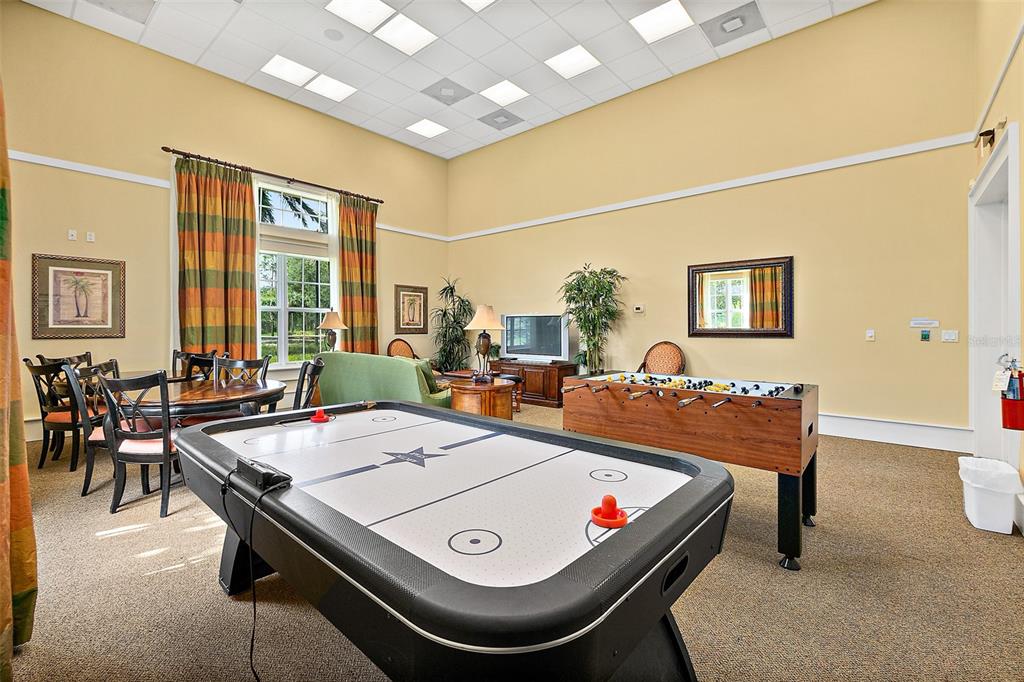 49 Longview Way North Palm Coast, FL 32137 - Photo 38 of 43 a living room with furniture pool table and a large window