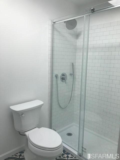 2 Oriole Road Orinda, CA 94563 - Photo 12 of 22 a white toilet next to a bathroom shower