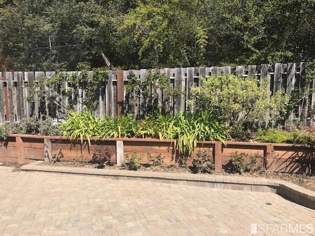 2 Oriole Road Orinda, CA 94563 - Photo 19 of 22 a wooden fence with trees in front of it