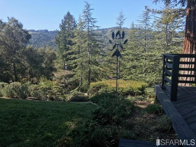 2 Oriole Road Orinda, CA 94563 - Photo 2 of 22 a view of a yard with plants and brick wall