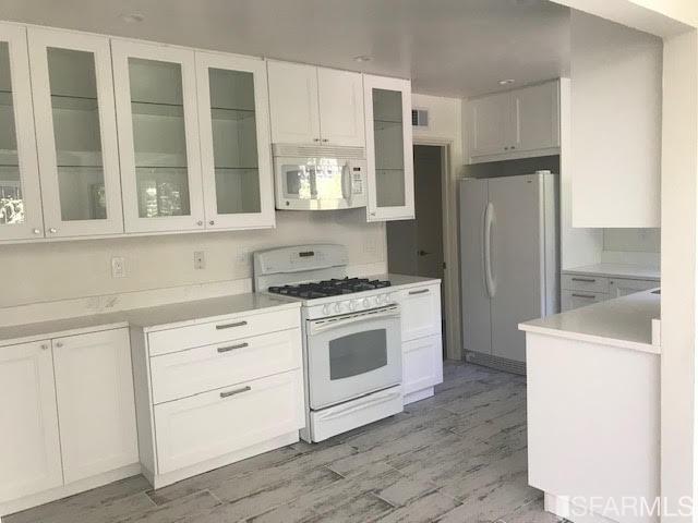 2 Oriole Road Orinda, CA 94563 - Photo 5 of 22 a kitchen with stainless steel appliances cabinets and a window