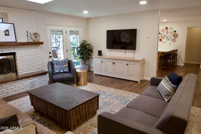 a living room with furniture and a large window