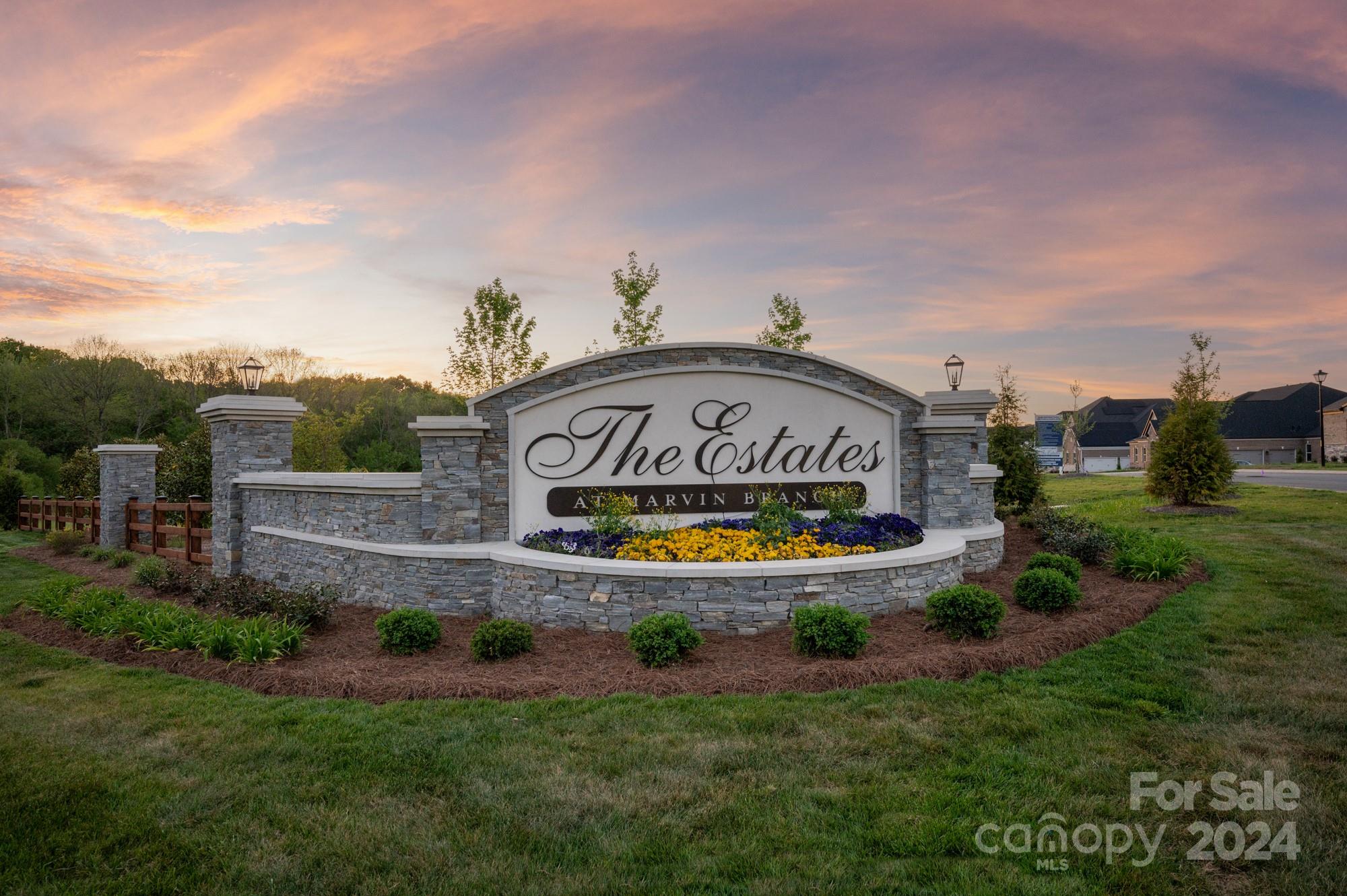 128 Ellison Way Waxhaw, NC 28173 - Photo 1 of 5 a view of a park with a sign on the wall