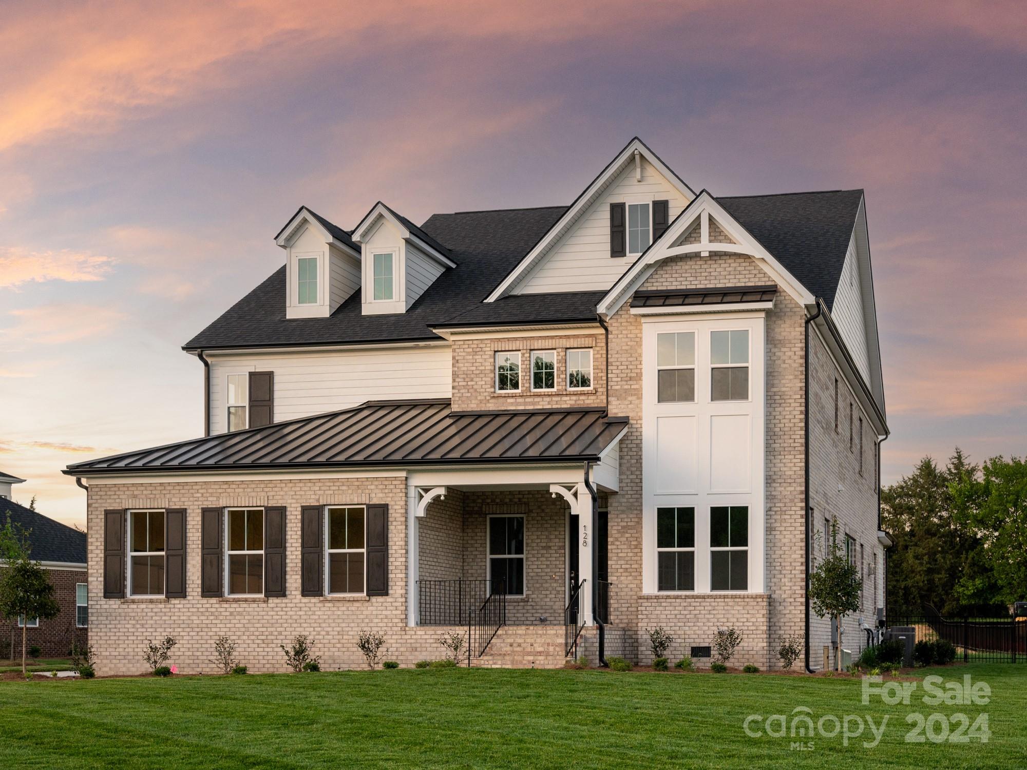 128 Ellison Way Waxhaw, NC 28173 - Photo 2 of 5 a front view of a house with a yard