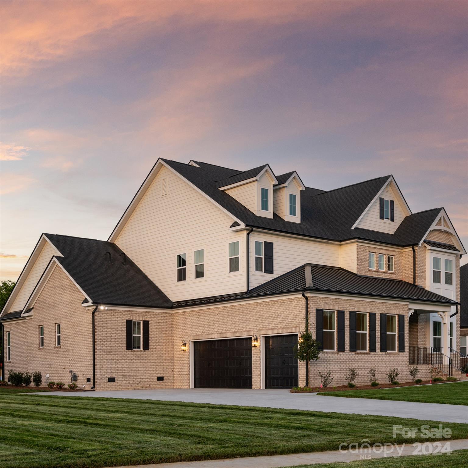 128 Ellison Way Waxhaw, NC 28173 - Photo 3 of 5 a front view of a house with a garden