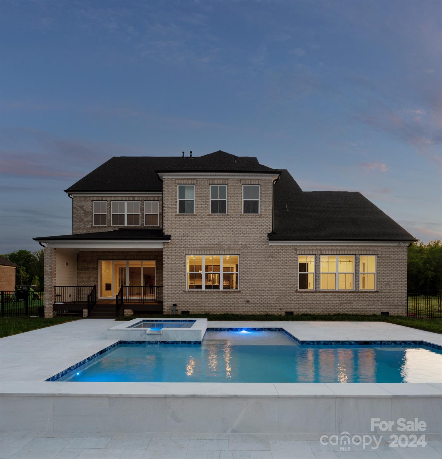 128 Ellison Way Waxhaw, NC 28173 - Photo 4 of 5 a front view of a house with swimming pool and outdoor seating