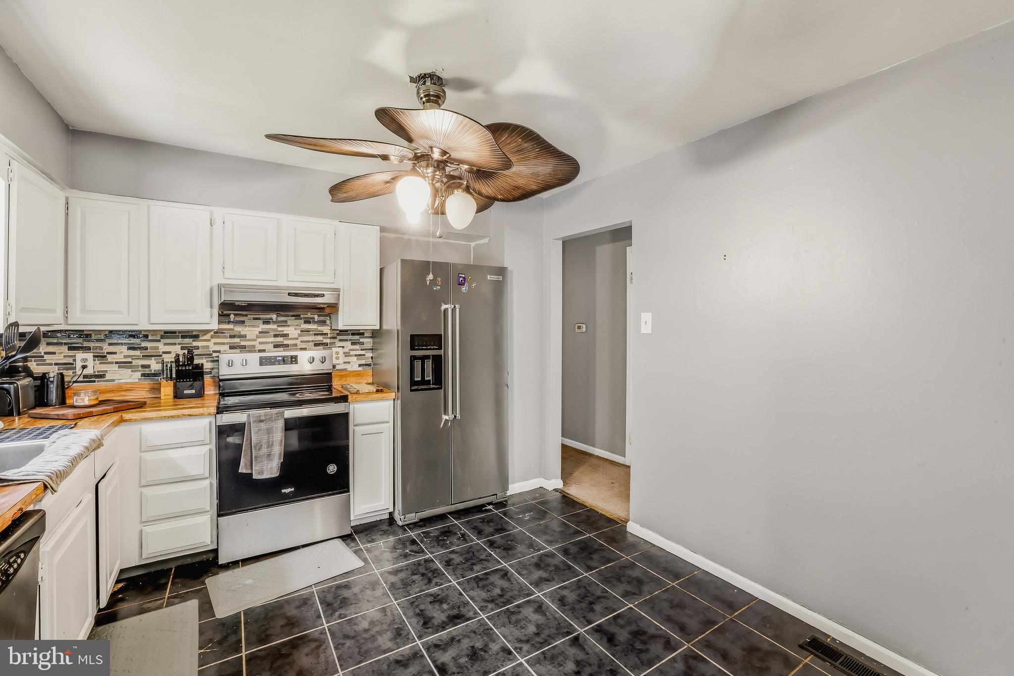 7 Matro Avenue Sicklerville, NJ 08081 - Photo 4 of 21 a kitchen with stainless steel appliances granite countertop a stove a refrigerator and a microwave