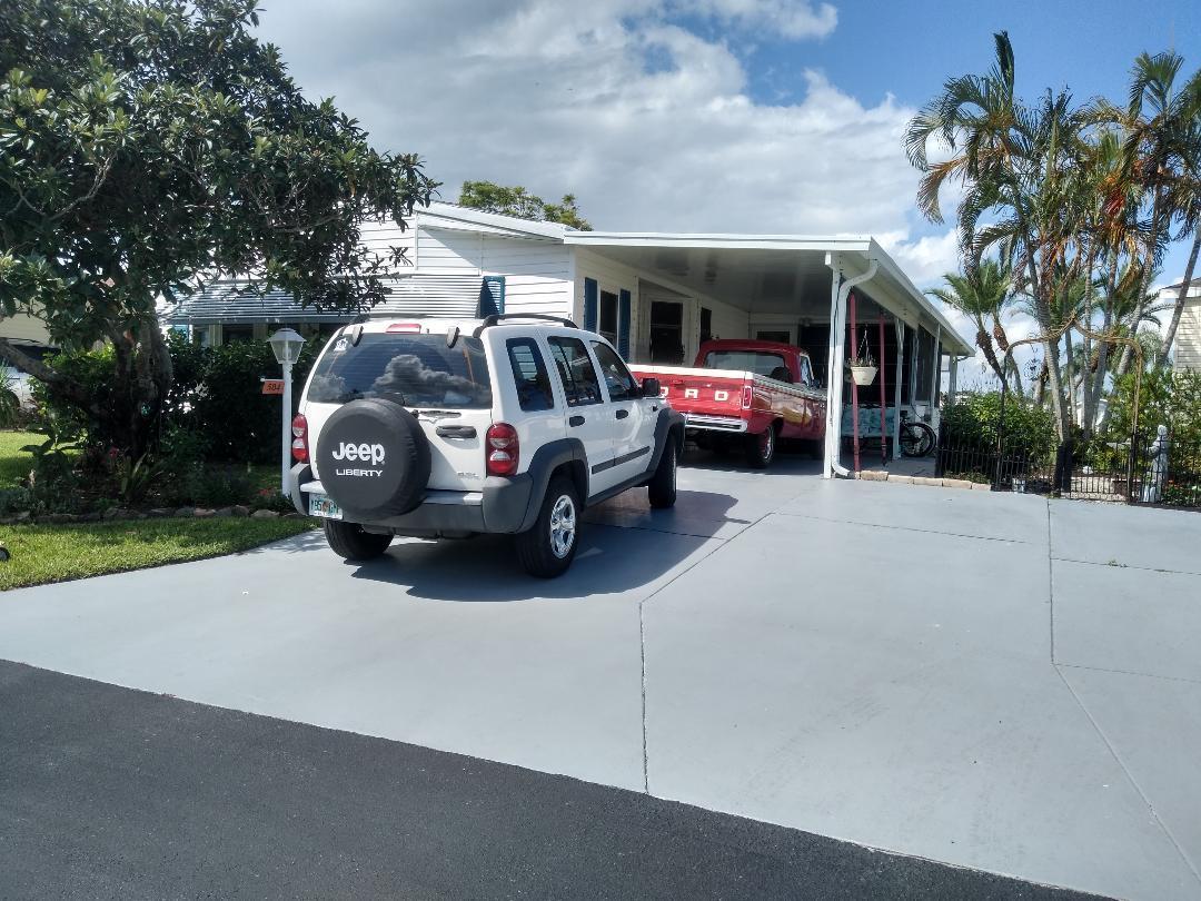504 Thames Bluff Ridge Fort Pierce, FL 34982 - Photo 5 of 35 Front View showing extra concrete parkin