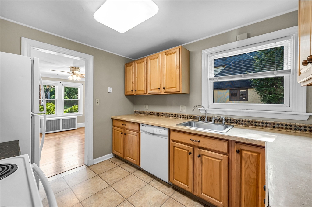 33 Emerson Road Longmeadow, MA 01106 - Photo 14 of 42 a kitchen with stainless steel appliances granite countertop a stove a sink and a microwave