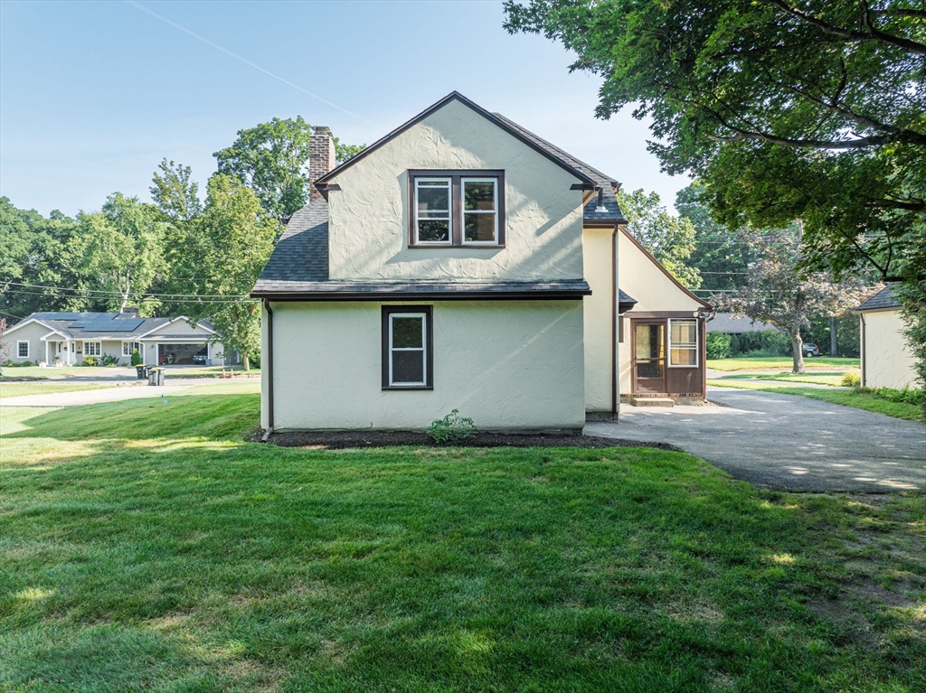 33 Emerson Road Longmeadow, MA 01106 - Photo 37 of 42 a front view of a house with garden