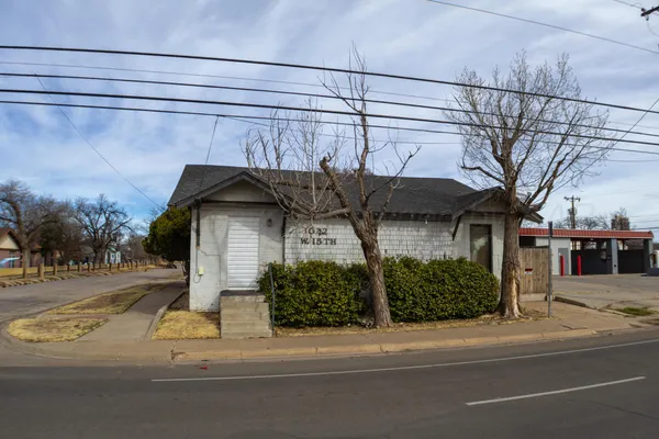 a view of a house with a street