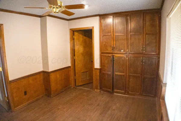 wooden floor and window in an empty room