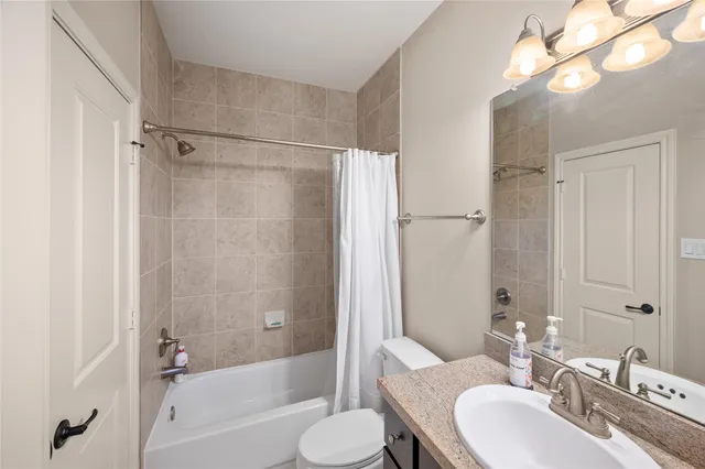 a view of a chair and table in the back yard of the house