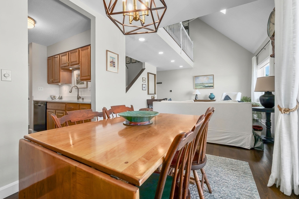 117 Water Street, Unit 28 Beverly, MA 01915 - Photo 11 of 35 a view of a dining room with furniture and wooden floor