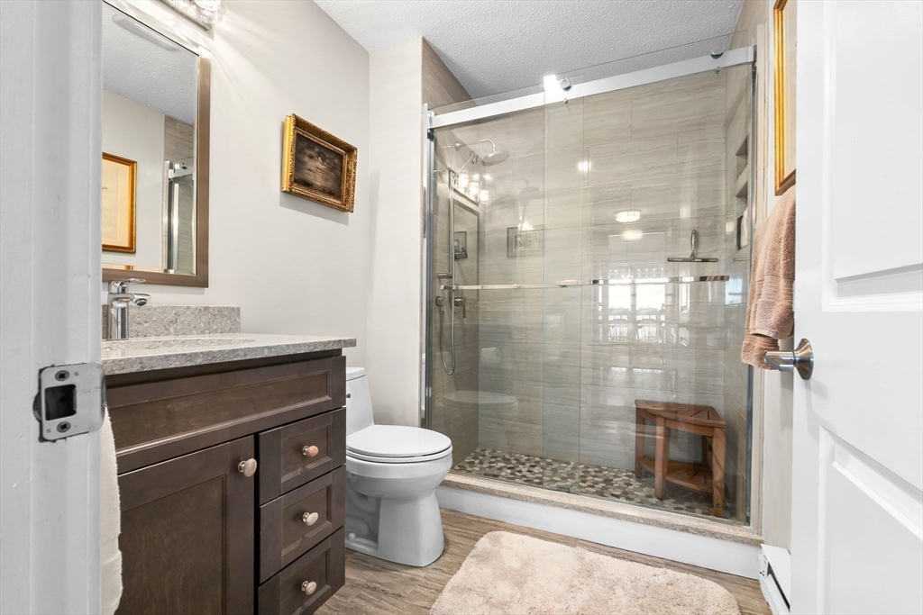 117 Water Street, Unit 28 Beverly, MA 01915 - Photo 20 of 35 a bathroom with a sink a toilet and shower