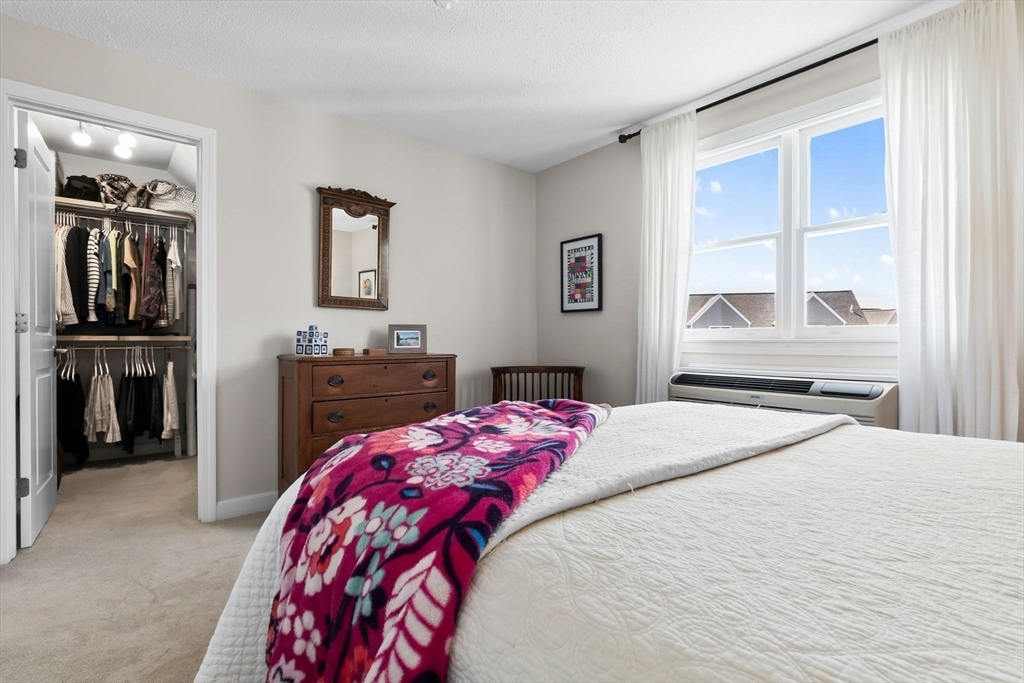 117 Water Street, Unit 28 Beverly, MA 01915 - Photo 22 of 35 a bedroom with a bed and a window