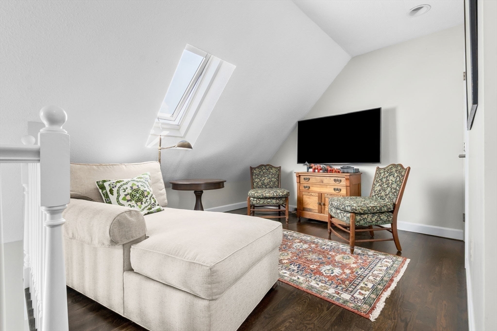 117 Water Street, Unit 28 Beverly, MA 01915 - Photo 24 of 35 a living room with furniture and a flat screen tv