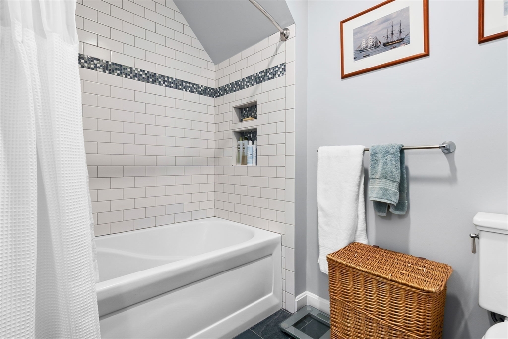 117 Water Street, Unit 28 Beverly, MA 01915 - Photo 26 of 35 a bathroom with a bathtub and shower
