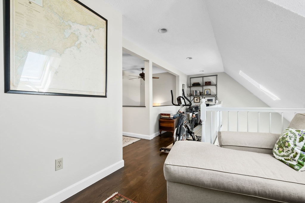 117 Water Street, Unit 28 Beverly, MA 01915 - Photo 28 of 35 a living room with furniture and a wooden floor