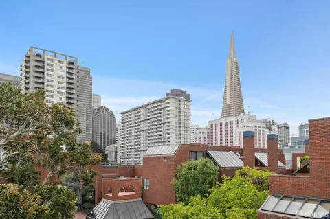 a view of city with tall buildings